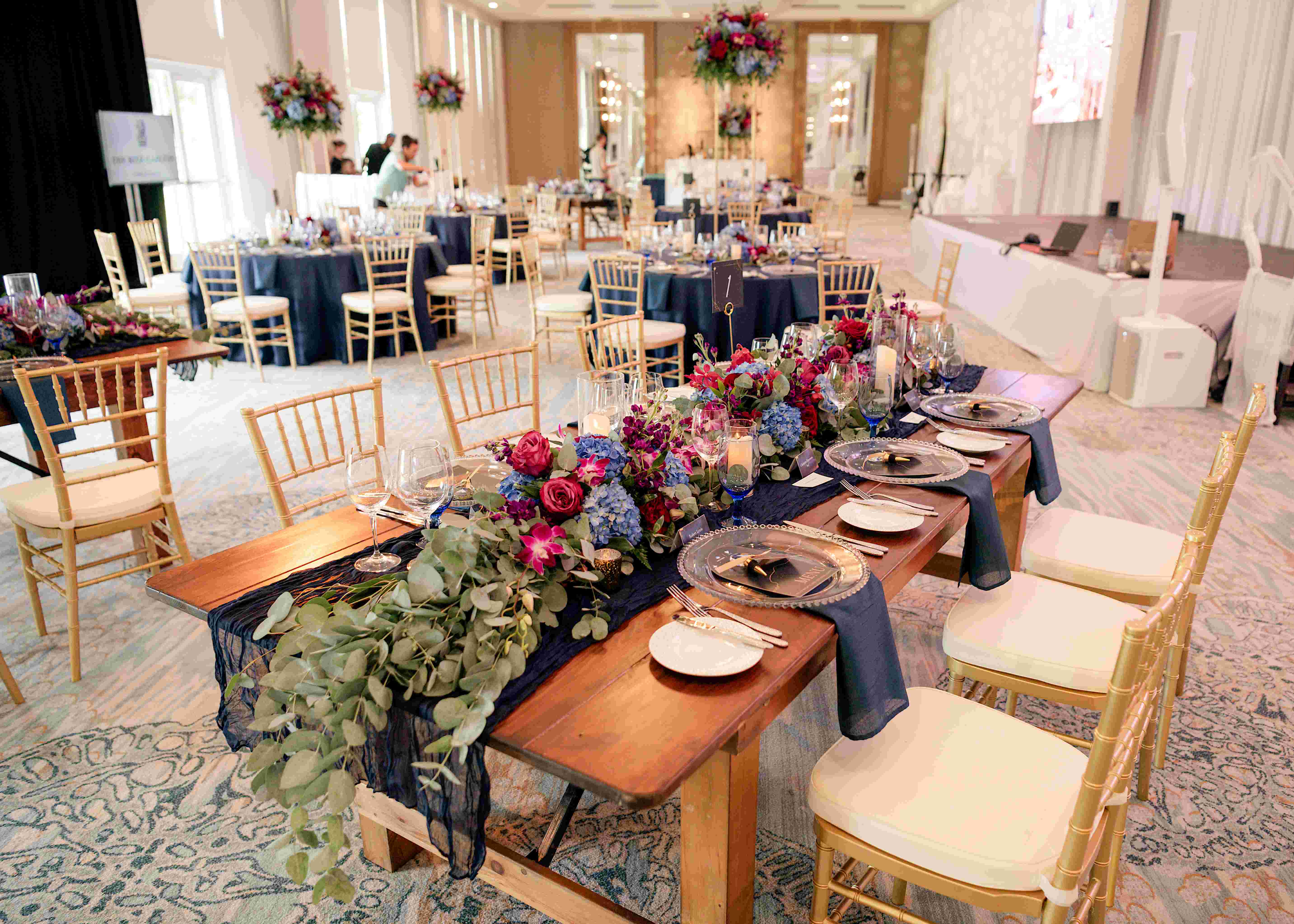 Luxury hotel gala event reception in Toronto, elegantly lit with floral centrepieces
