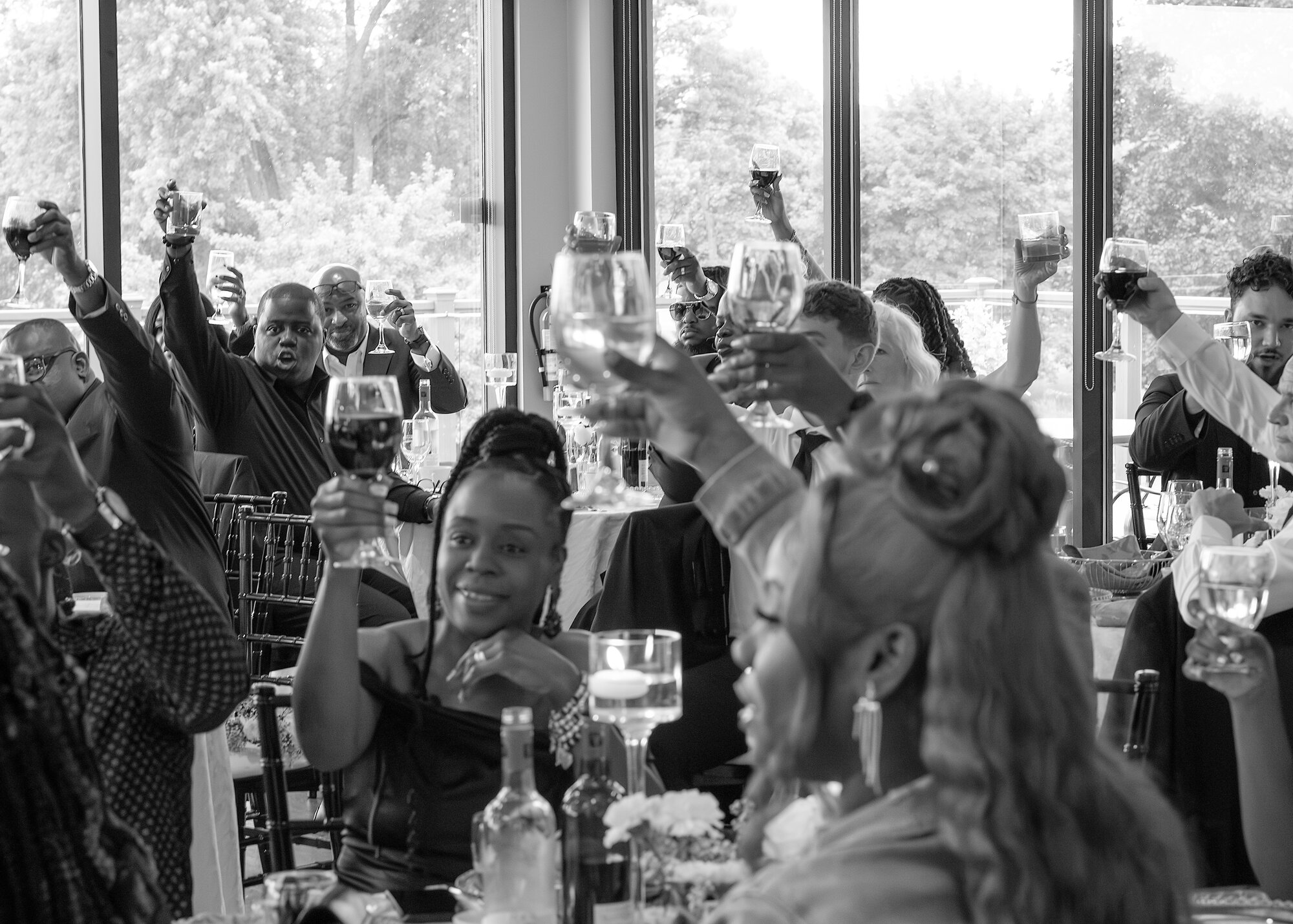 Wedding guests celebrating with a reception toast in Hamilton, Ontario — the memories delivered to you by NN Popa Photography
