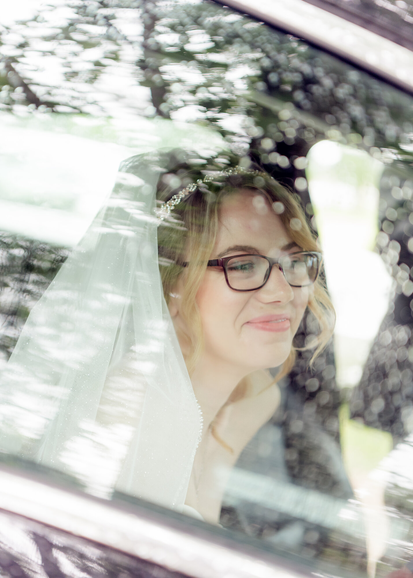 Bride in a car on her Kitchener wedding day — captured by NN Popa Photography