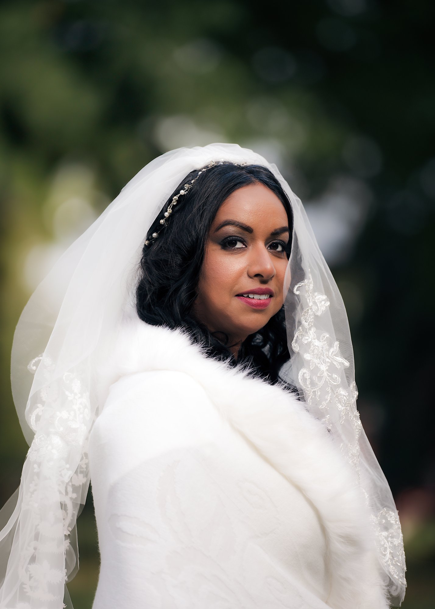 Bride wearing an embroidered veil in a soft outdoor portrait in Kitchener, Ontario — fine art wedding photography by NN Popa
