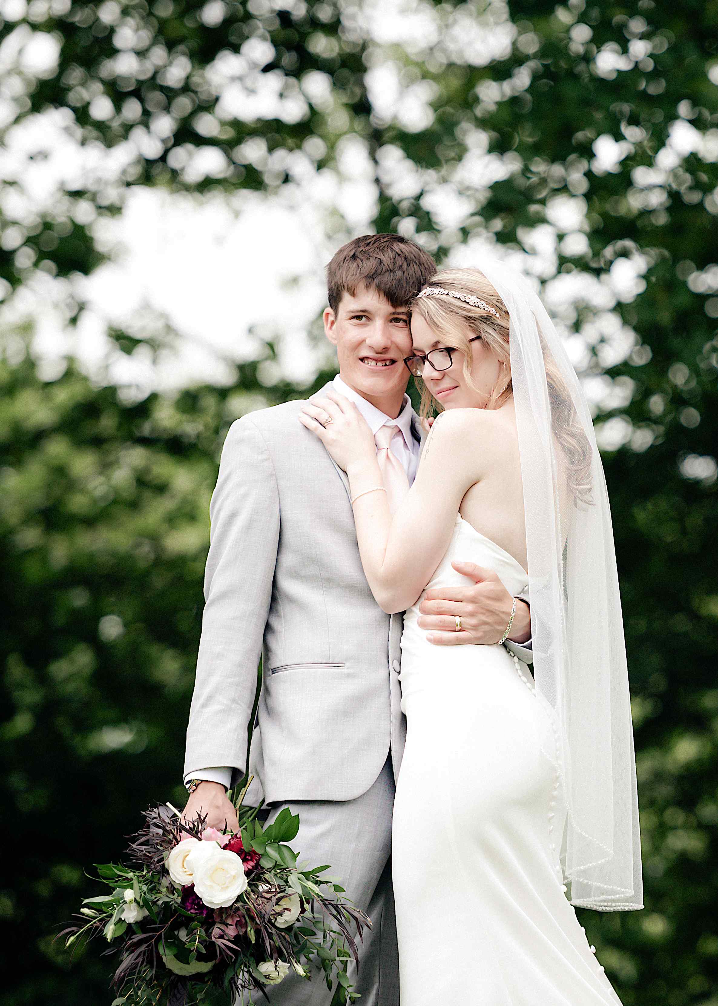 Tender wedding couple embrace at a destination venue — fine art documentary photography by NN Popa